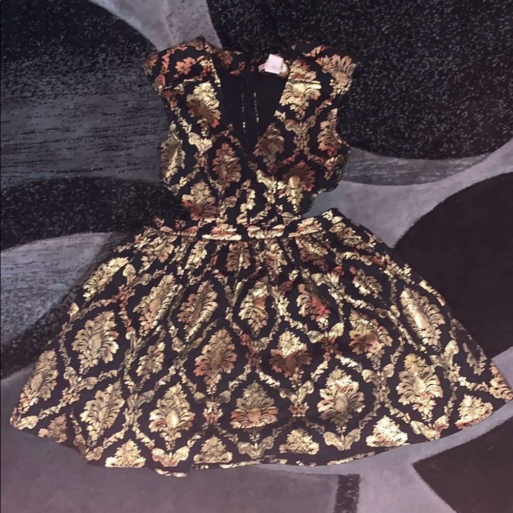 black and gold mini cocktail dress.